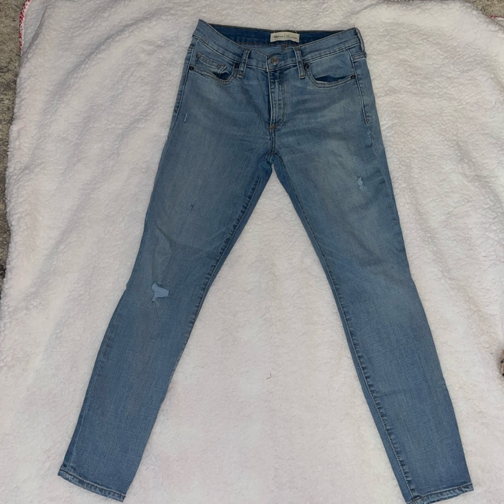 Size 27R skinny jeans with light distress